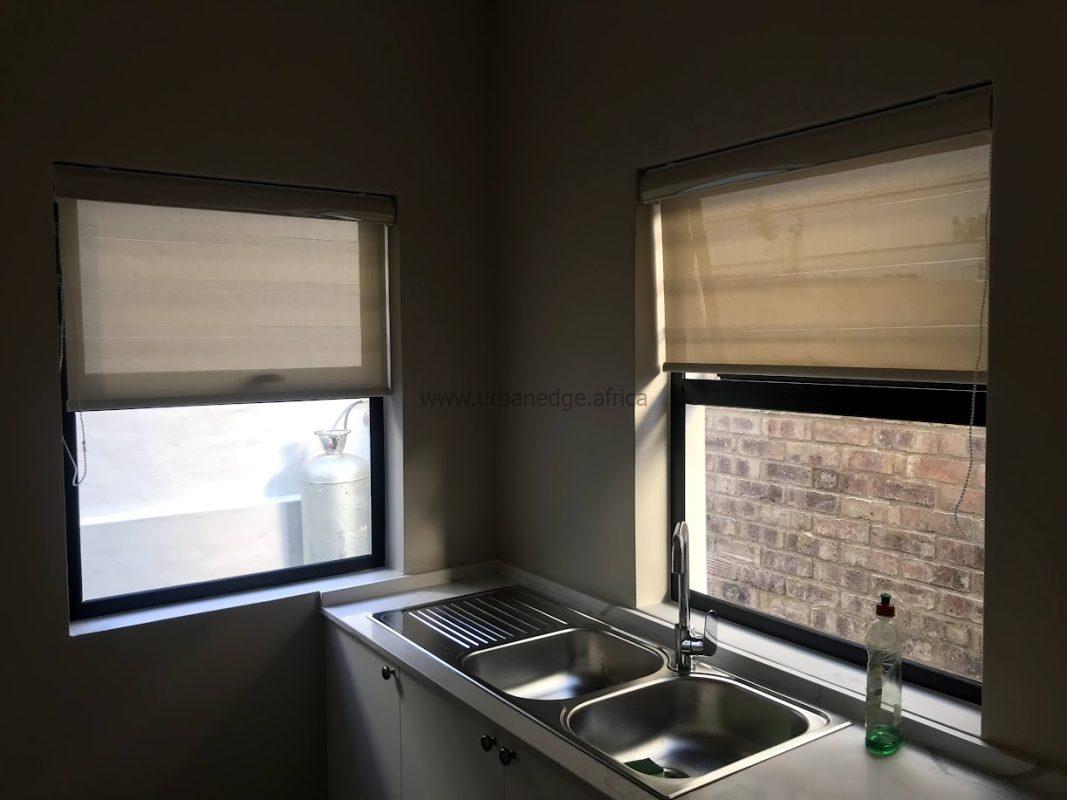Light-filtering roller blind allowing soft daylight in Harare kitchen